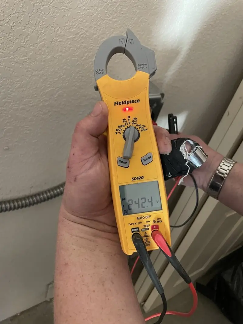 Voltage testing with clamp meter during Recessed Lighting Installation in Allen Park